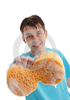 Boy using a soapy sponge to clean photo