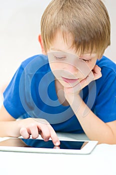Boy using tablet computer