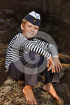 The boy in the vest and the marine cap
