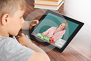 Boy Videoconferencing On Digital Tablet