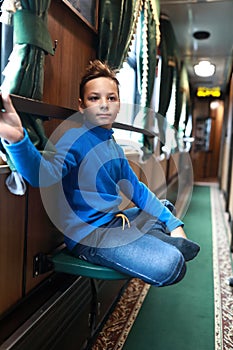 Boy in vintage train carriage