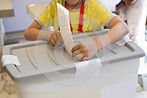 Boy voting on democratic election.