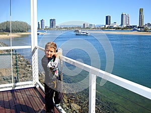 A boy is waiting for his yacht cruise on Gold Coast .. Australia