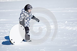 Boy walking in the snow