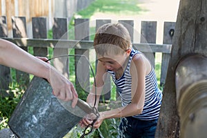 Boy washes well water. photo