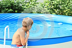 Boy watching a pool