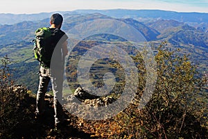 Boy watching the valley bellow