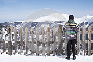 Boy watchs the mountain