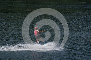 Boy water-skiing on a lake in Niedersfeld, Germany