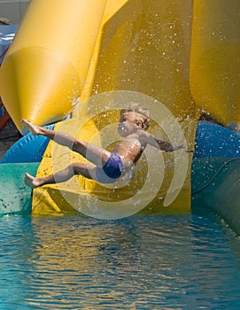 Boy on water slide