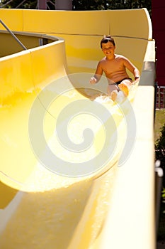Boy on water slide