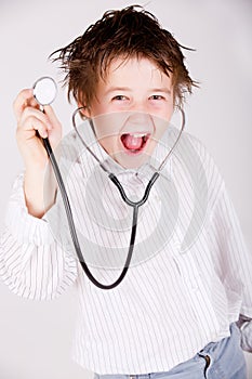 Boy wearing a doctors uniform