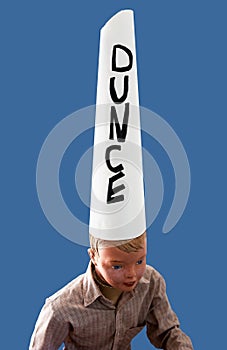 Boy wearing dunce cap
