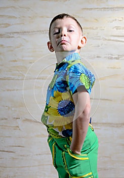 Boy Wearing Floral Print Shirt with Hands on Hips