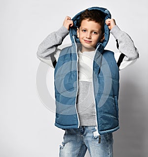 Boy wearing on head casual outwear vest hood studio shot