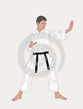 Boy wearing kimono and karate training