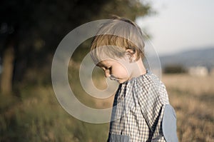 Boy wearing a kinder garden overall photo