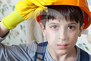 Boy wearing a protective helmet and gloves