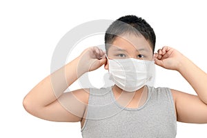 Boy wearing protective mask to protect pollution and flu