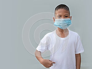 Boy wearing a protective mask On a white background. New normal concept