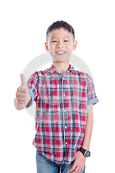 Boy wearing red and blue shirt smiling with thunb up