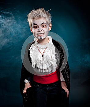 BOy wearing vampire for halloween