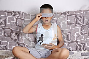 Boy wearing virtual reality glasses