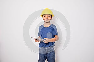 Boy wearing yellow hat engineer idea