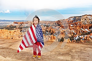 Boy wears USA flag, celebrating 4th July