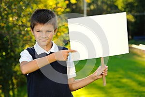 The boy with a white blank board