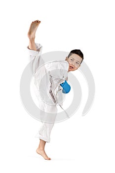 The boy in a white kimono battles or trains