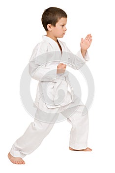 Boy in white kimono posing