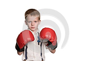 Boy in white shirt and gloves boxing