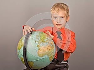 The boy who rotates the globe. photo