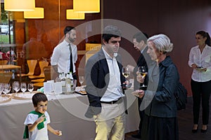 Wine tasting posh reception bar caucasian senior man woman boy reception restaurant