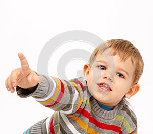 Boy in winter clothes pointing