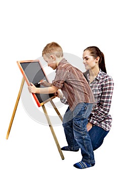 A boy, woman and blackboard.Writing