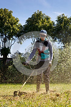 Boy working on a trimmer