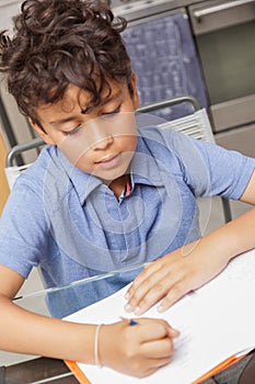 BOY WORKS AT HOME DURING CONTAINMENT PERIOD