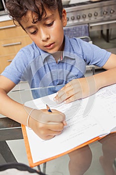 BOY WORKS AT HOME DURING CONTAINMENT PERIOD