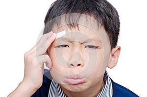 Boy with wound on head cover by plaster