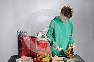 Boy wrapping up christmas gifts