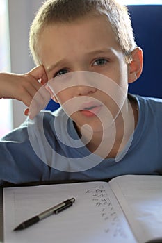 Boy writing homework