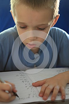 Boy writing homework