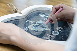 Boy writing I love mom