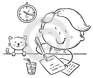 Boy writing a letter or making homework at the desk