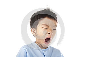 Boy yawn after woke up in the morning