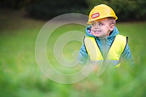 Boy with a yellow builder helmet