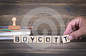 Boycott. Wooden letters on the office desk photo
