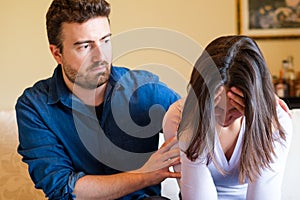 Boyfriend consoling his girlfriend after big fight